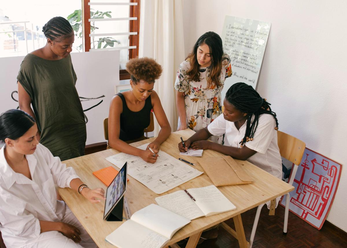 Professional women collaborating around a table